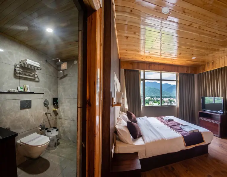 Bathroom seen from the bedroom, with the shower area beyond