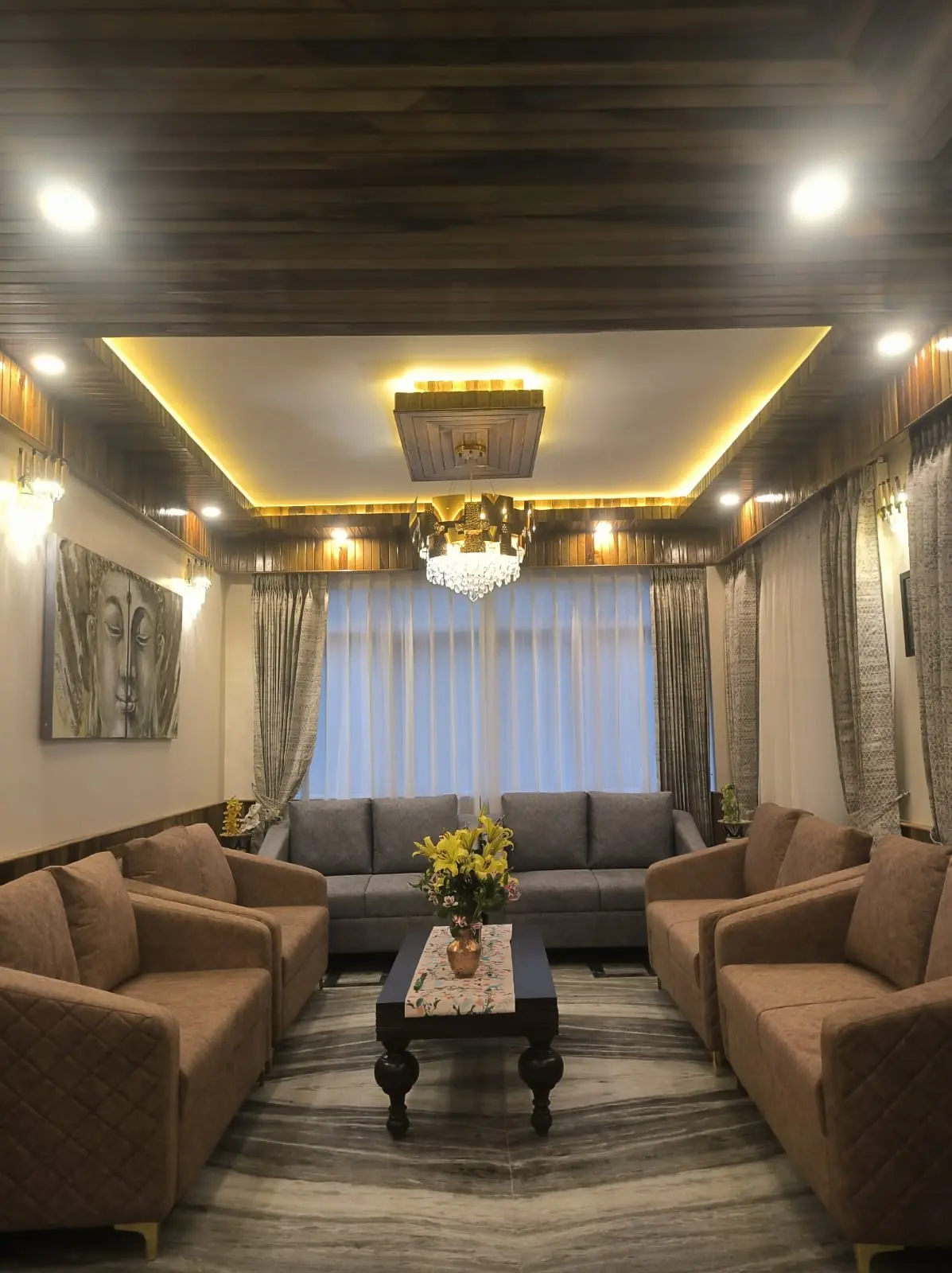 The hotel lounge with sofas and warm ceiling lighting